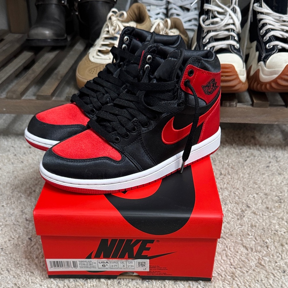 Nike Women’s Air Jordan 1 high OG Satin Bred Black and Red Sneakers
